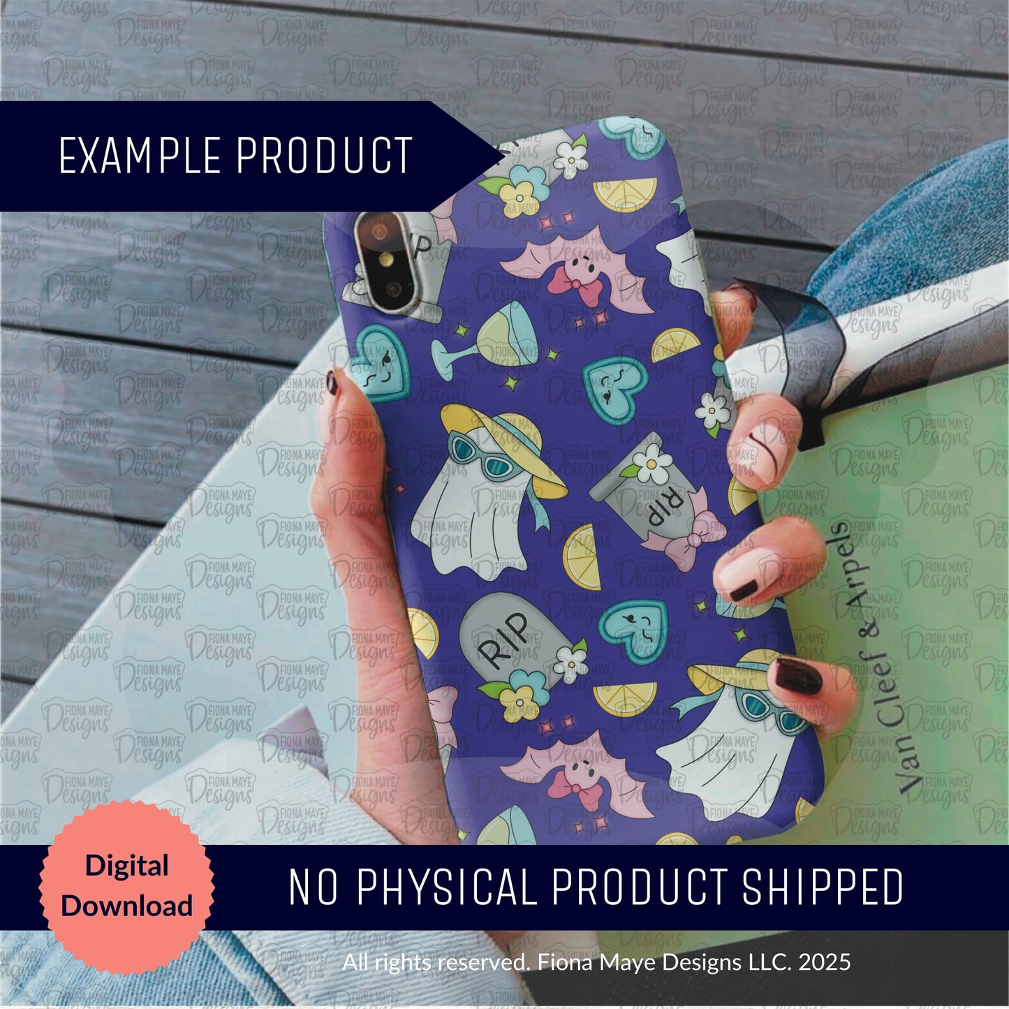 Phone case with a ghosts and tombstones design held by a person, on a wooden surface.